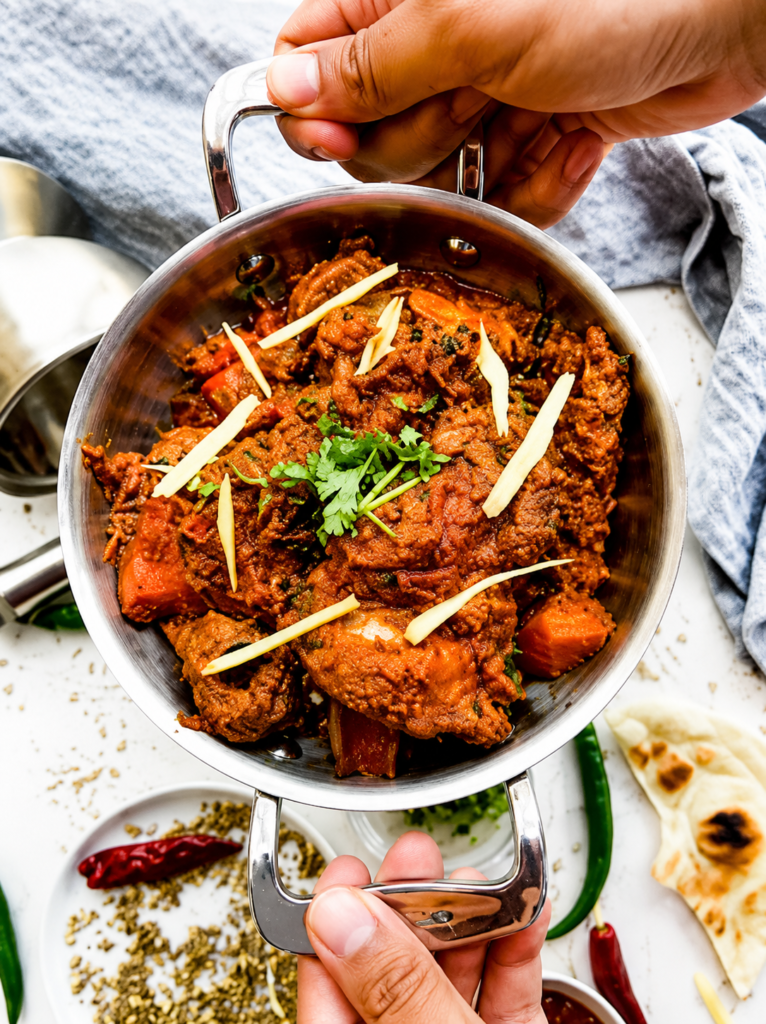 Goat karahi in traditional pan, finished with ginger and tomatoes at Dewan-e-Khass